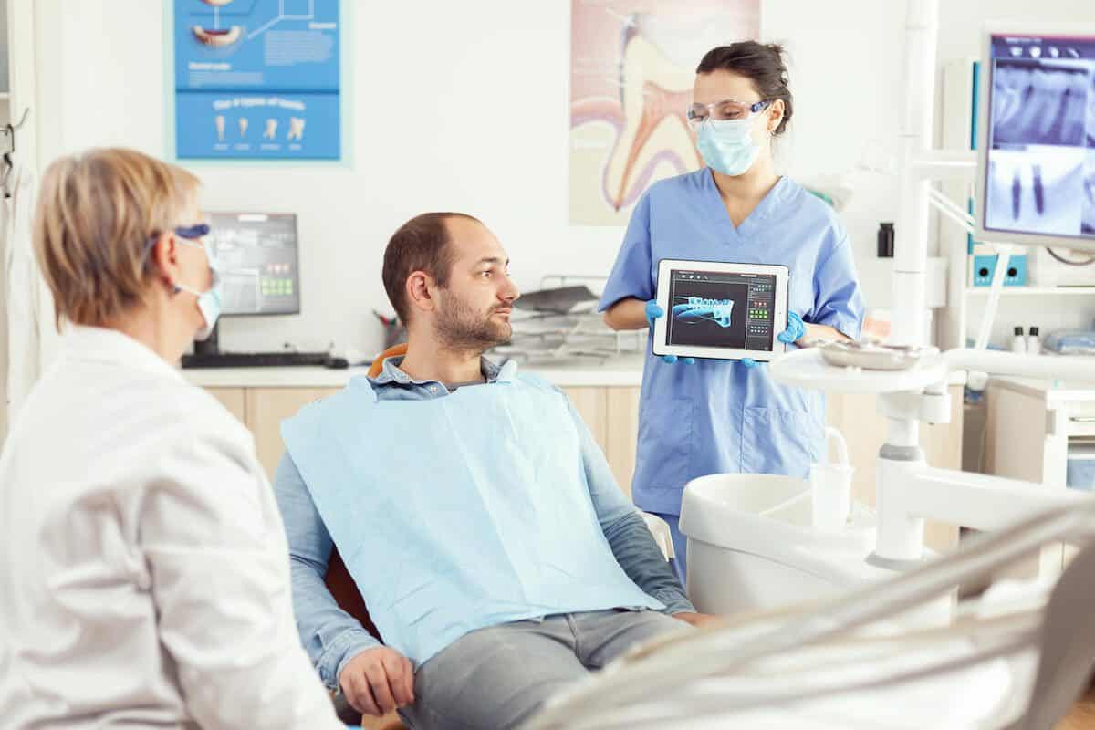 Laser teeth whitening treatment being applied by a dental professional Telford